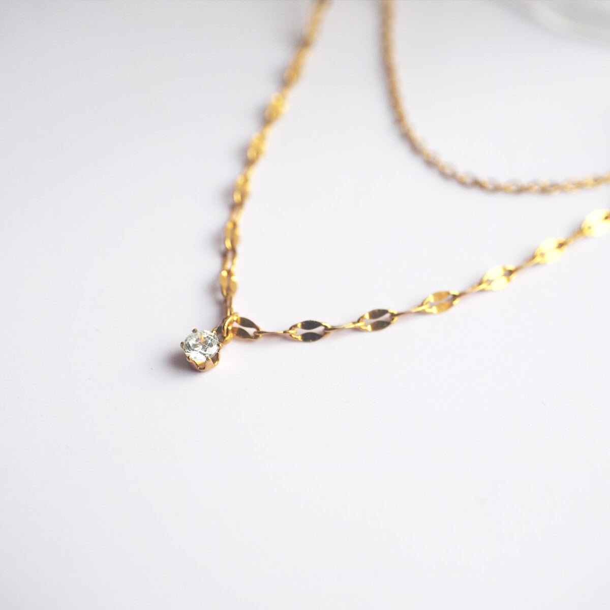 elegant-gold-necklace-with-a-crystal.jpg